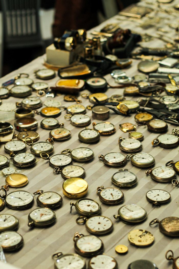 Mastering the First Impression: Your intriguing post title goes here An assortment of vintage pocket watches displayed on a table featuring various styles and designs.
